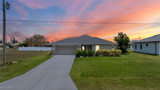 1929 NW 18th St, Cape Coral, FL 33993 - view of front of home with a garage and concrete driveway
