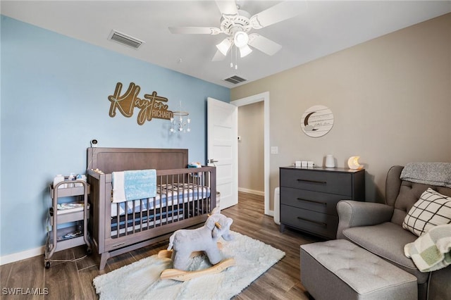 1929 NW 18th St, Cape Coral, FL 33993 - bedroom with baseboards, wood finished floors, and ceiling fan