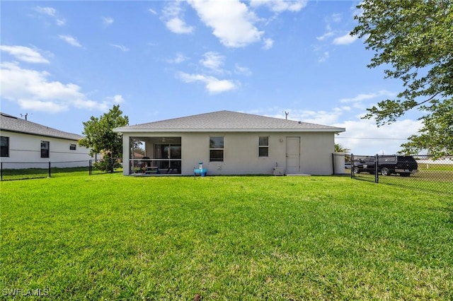 1929 NW 18th St, Cape Coral, FL 33993 - back of house with a sunroom and stucco siding