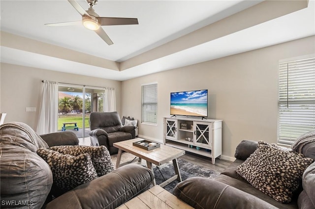 1929 NW 18th St, Cape Coral, FL 33993 - living room with wood finished floors, ceiling fan, and baseboards