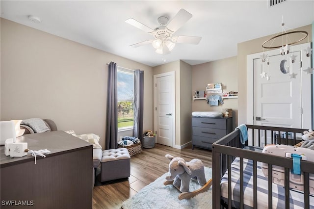 1929 NW 18th St, Cape Coral, FL 33993 - bedroom featuring wood finished floors, ceiling fan, and baseboards