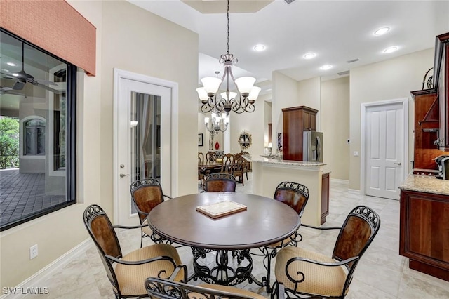 7748 Classics Dr, Naples, FL 34113 - dining space with baseboards, a chandelier, light marble finish flooring, and recessed lighting