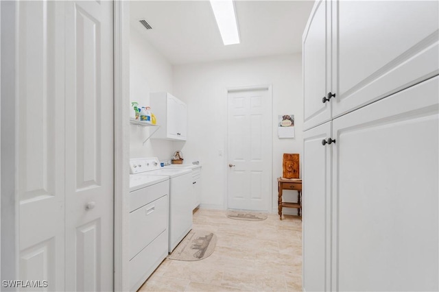 2871 Bracci Dr, Saint James City, FL 33956 - laundry area featuring cabinet space and washer and clothes dryer
