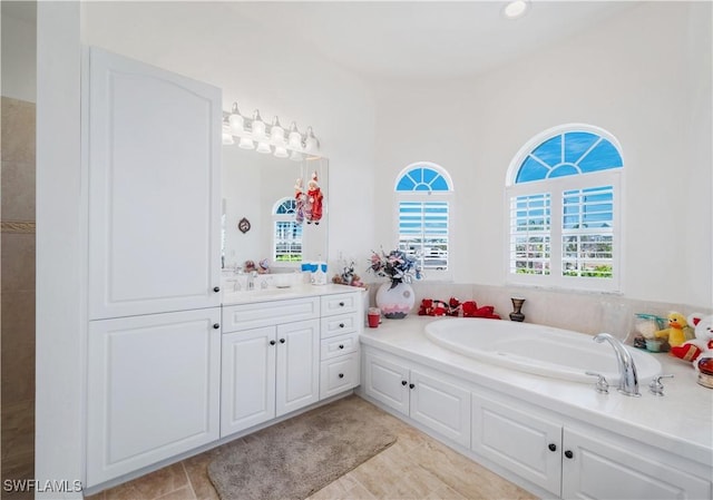 2871 Bracci Dr, Saint James City, FL 33956 - bathroom featuring vanity and a garden tub