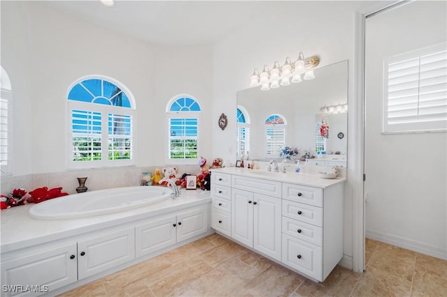 2871 Bracci Dr, Saint James City, FL 33956 - full bath featuring vanity and a garden tub