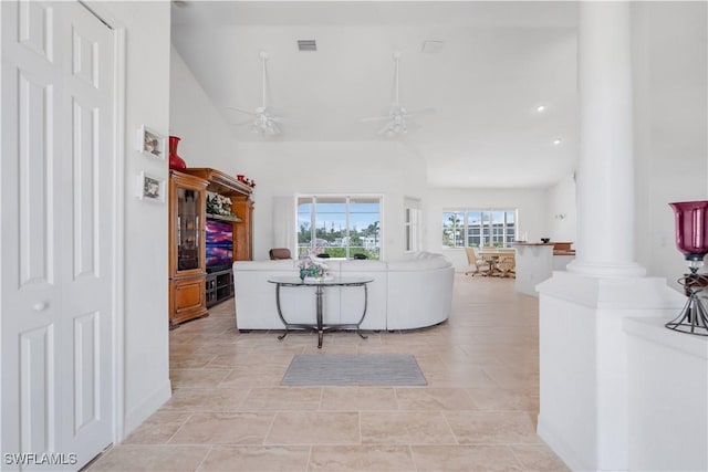 2871 Bracci Dr, Saint James City, FL 33956 - living room featuring decorative columns, a ceiling fan, and lofted ceiling
