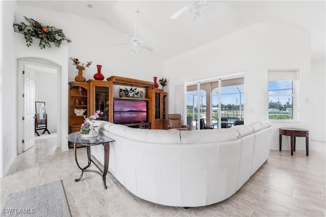 2871 Bracci Dr, Saint James City, FL 33956 - living area with a ceiling fan, arched walkways, and high vaulted ceiling