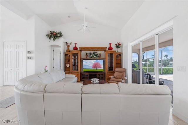 2871 Bracci Dr, Saint James City, FL 33956 - living area with a ceiling fan, high vaulted ceiling, and arched walkways