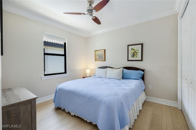 26304 Prince Pierre Way, Bonita Springs, FL 34135 - bedroom with a closet, light wood-style floors, baseboards, ornamental molding, and ceiling fan