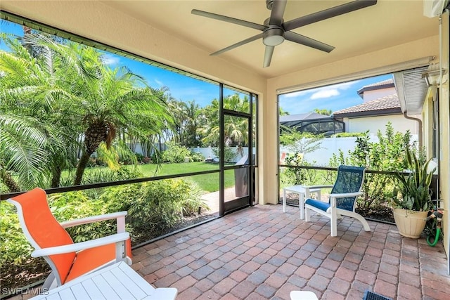 26304 Prince Pierre Way, Bonita Springs, FL 34135 - unfurnished sunroom featuring ceiling fan