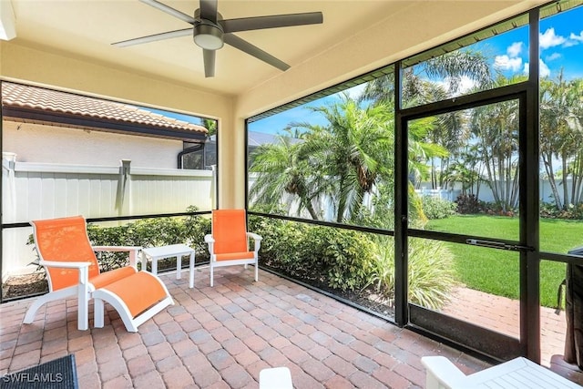 26304 Prince Pierre Way, Bonita Springs, FL 34135 - sunroom with a ceiling fan and a water view