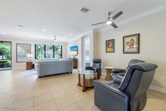 26304 Prince Pierre Way, Bonita Springs, FL 34135 - living area with a ceiling fan, healthy amount of natural light, crown molding, light tile patterned floors, and baseboards