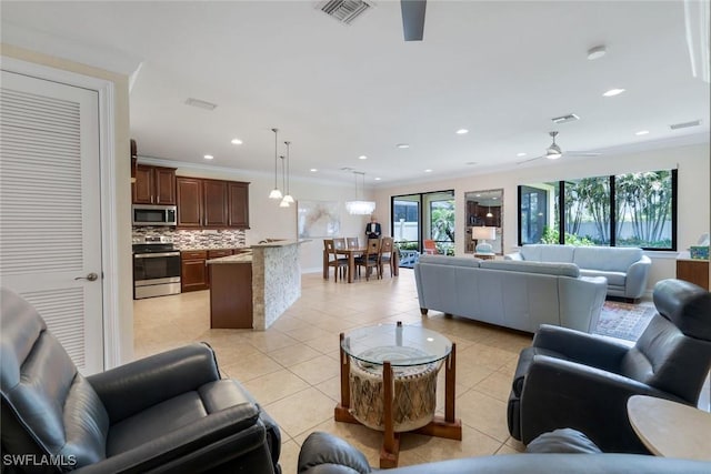26304 Prince Pierre Way, Bonita Springs, FL 34135 - living area featuring ceiling fan, light tile patterned floors, recessed lighting, and ornamental molding