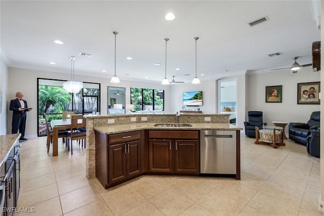26304 Prince Pierre Way, Bonita Springs, FL 34135 - kitchen with stainless steel dishwasher, a sink, open floor plan, light tile patterned flooring, and crown molding