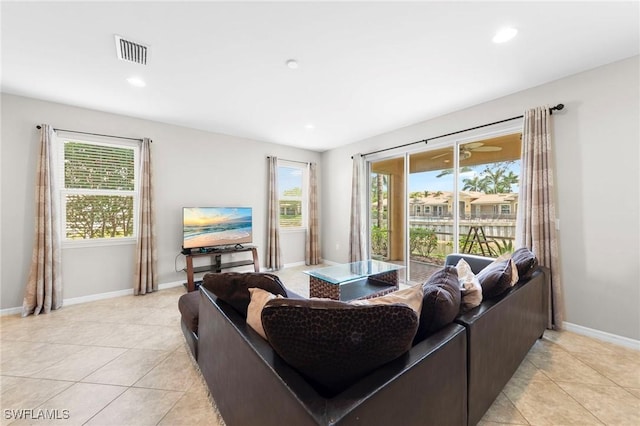 10844 Alvara Point Dr, Bonita Springs, FL 34135 - living area featuring light tile patterned floors, baseboards, and recessed lighting