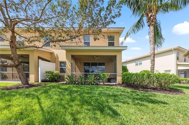 10844 Alvara Point Dr, Bonita Springs, FL 34135 - view of front of house with stucco siding, a front lawn, and ceiling fan