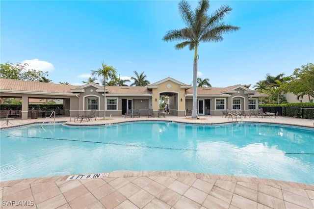 10844 Alvara Point Dr, Bonita Springs, FL 34135 - community pool featuring a patio area