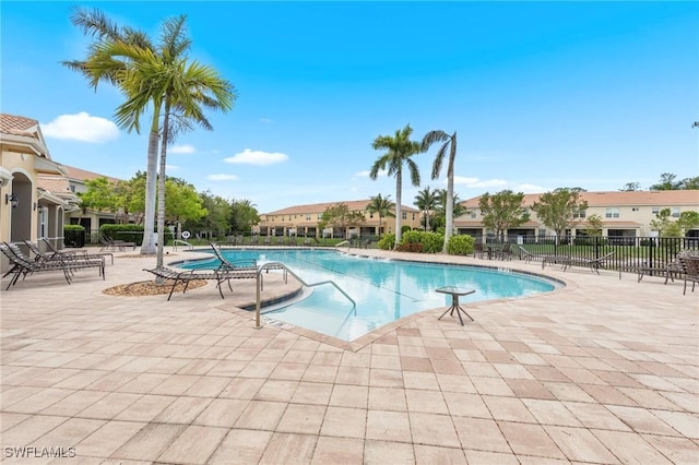 10844 Alvara Point Dr, Bonita Springs, FL 34135 - community pool with a patio