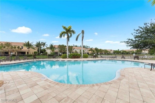 10844 Alvara Point Dr, Bonita Springs, FL 34135 - community pool with a patio area