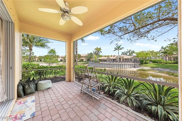 10844 Alvara Point Dr, Bonita Springs, FL 34135 - sunroom / solarium featuring a water view and a ceiling fan