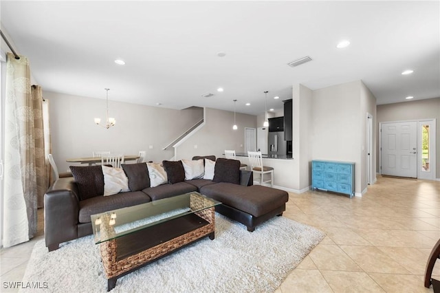 10844 Alvara Point Dr, Bonita Springs, FL 34135 - living room with light tile patterned floors, a chandelier, recessed lighting, and baseboards