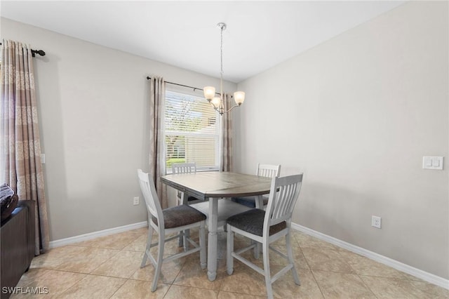 10844 Alvara Point Dr, Bonita Springs, FL 34135 - dining space with a chandelier, light tile patterned floors, and baseboards