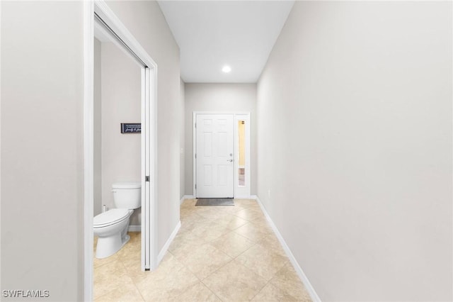10844 Alvara Point Dr, Bonita Springs, FL 34135 - hallway with light tile patterned floors, baseboards, and recessed lighting