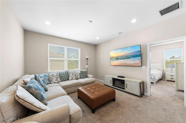 10844 Alvara Point Dr, Bonita Springs, FL 34135 - living room featuring plenty of natural light, light carpet, recessed lighting, and baseboards