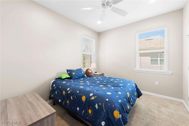 10844 Alvara Point Dr, Bonita Springs, FL 34135 - bedroom featuring carpet floors, baseboards, multiple windows, and a ceiling fan