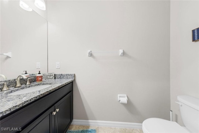 10844 Alvara Point Dr, Bonita Springs, FL 34135 - half bath featuring toilet, vanity, baseboards, and tile patterned floors