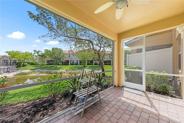 10844 Alvara Point Dr, Bonita Springs, FL 34135 - sunroom with a ceiling fan and a water view