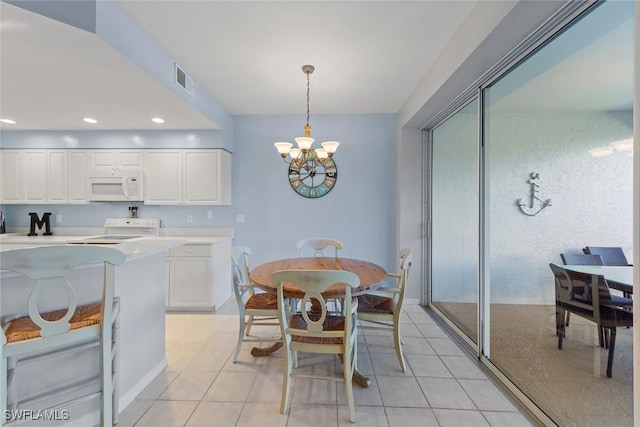 4410 Riverwatch Dr Unit 102, Bonita Springs, FL 34134 - dining room with a chandelier, light tile patterned floors, and recessed lighting