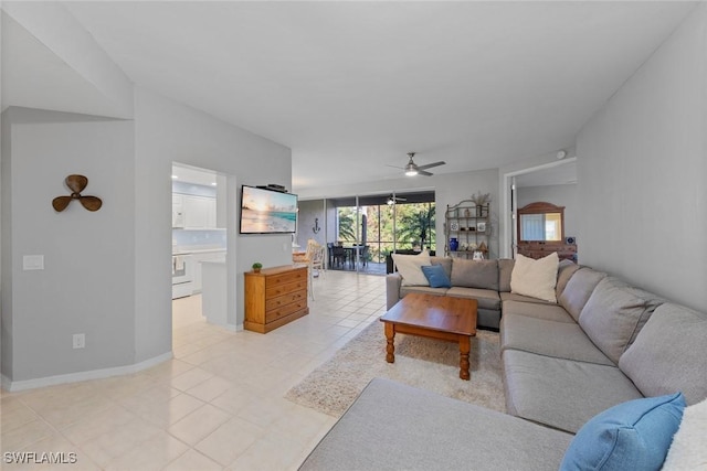 4410 Riverwatch Dr Unit 102, Bonita Springs, FL 34134 - living room with ceiling fan, light tile patterned flooring, and baseboards