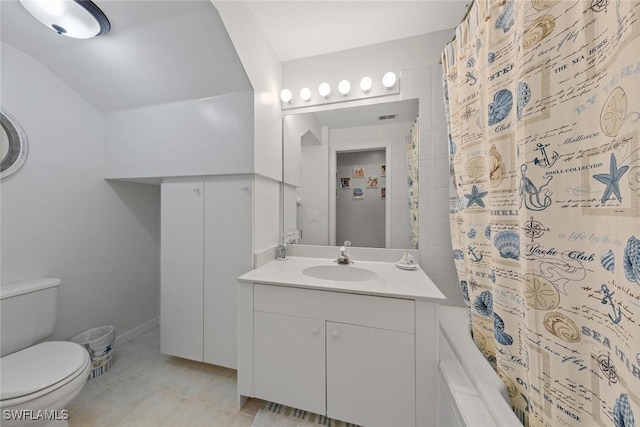 4410 Riverwatch Dr Unit 102, Bonita Springs, FL 34134 - bathroom with shower / bath combination with curtain, vanity, toilet, tile patterned floors, and lofted ceiling