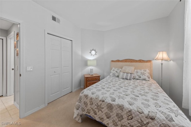4410 Riverwatch Dr Unit 102, Bonita Springs, FL 34134 - bedroom featuring a closet, light colored carpet, and baseboards