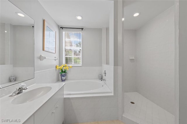 4410 Riverwatch Dr Unit 102, Bonita Springs, FL 34134 - full bath featuring a bath, vanity, a walk in shower, and recessed lighting