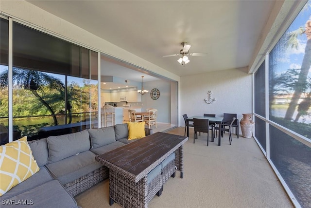 4410 Riverwatch Dr Unit 102, Bonita Springs, FL 34134 - sunroom / solarium with ceiling fan, outdoor dining area, an outdoor hangout area, and a chandelier