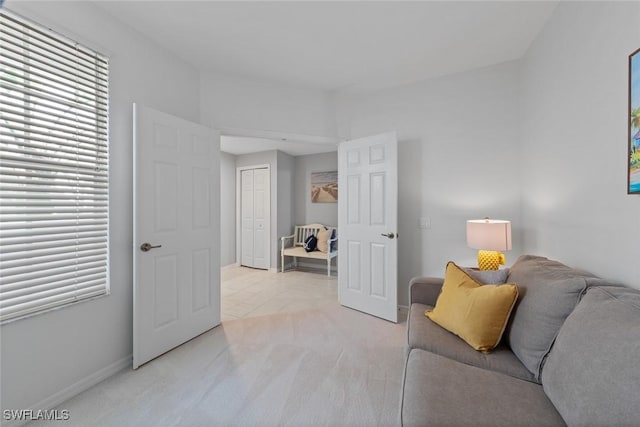 4410 Riverwatch Dr Unit 102, Bonita Springs, FL 34134 - living room featuring light carpet and baseboards