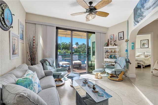 2249 Anchorage Ln Unit B, Naples, FL 34104 - living area with arched walkways, a ceiling fan, and light tile patterned floors