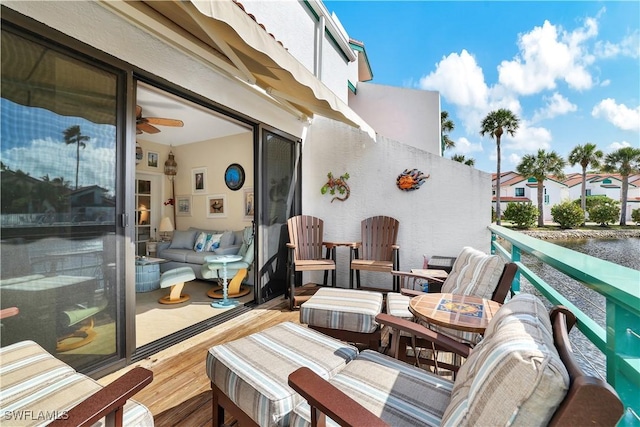 2249 Anchorage Ln Unit B, Naples, FL 34104 - view of wooden balcony with a deck and an outdoor living space
