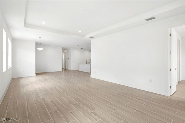 44320 Panther Dr, Punta Gorda, FL 33982 - unfurnished living room with light wood-type flooring and recessed lighting