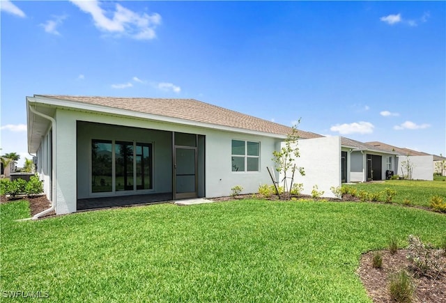 44320 Panther Dr, Punta Gorda, FL 33982 - back of house featuring a yard and stucco siding