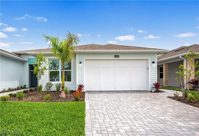 44320 Panther Dr, Punta Gorda, FL 33982 - ranch-style home with decorative driveway and a garage