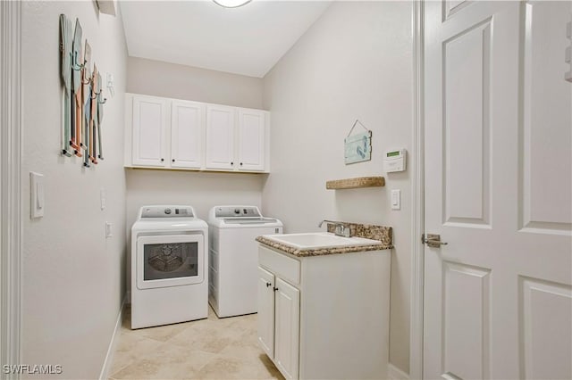 12732 Kinross Ln, Naples, FL 34120 - washroom with independent washer and dryer, cabinet space, and baseboards