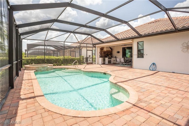 12732 Kinross Ln, Naples, FL 34120 - view of swimming pool featuring a patio, a pool with connected hot tub, glass enclosure, and outdoor dining space