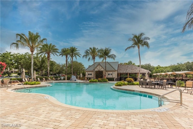 12732 Kinross Ln, Naples, FL 34120 - community pool with a patio