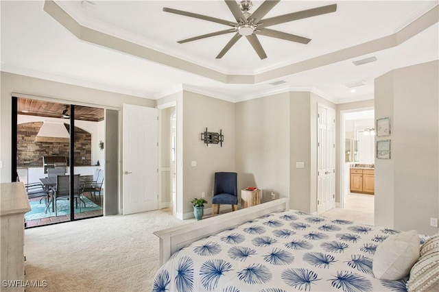 12732 Kinross Ln, Naples, FL 34120 - bedroom featuring a tray ceiling, light carpet, access to exterior, ornamental molding, and ensuite bath