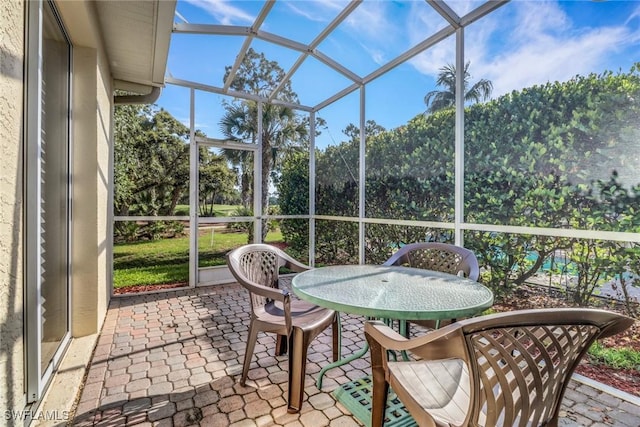 8515 Chase Preserve Dr, Naples, FL 34113 - sunroom with outdoor dining area