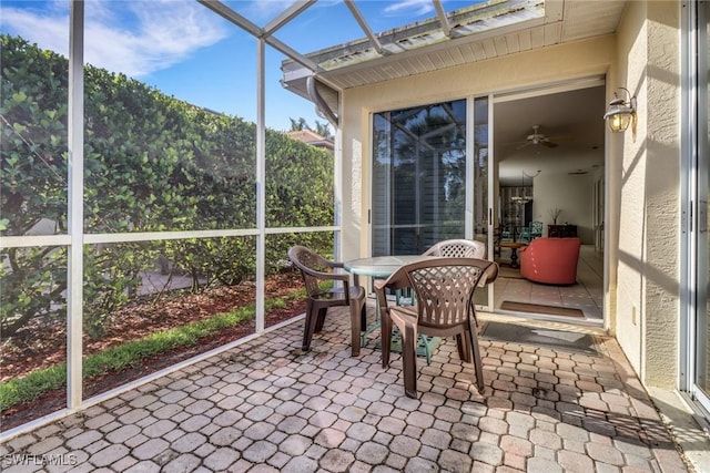 8515 Chase Preserve Dr, Naples, FL 34113 - sunroom featuring ceiling fan and outdoor dining area