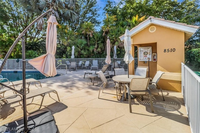 8515 Chase Preserve Dr, Naples, FL 34113 - view of patio featuring outdoor dining area